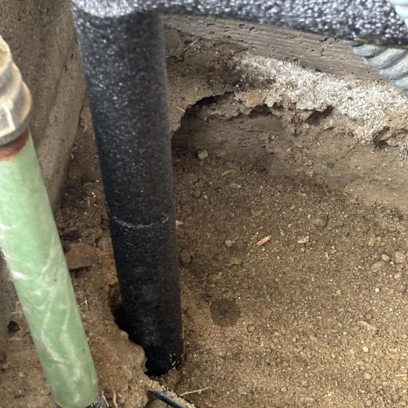PVC water main pipe crack in crawl space dirt