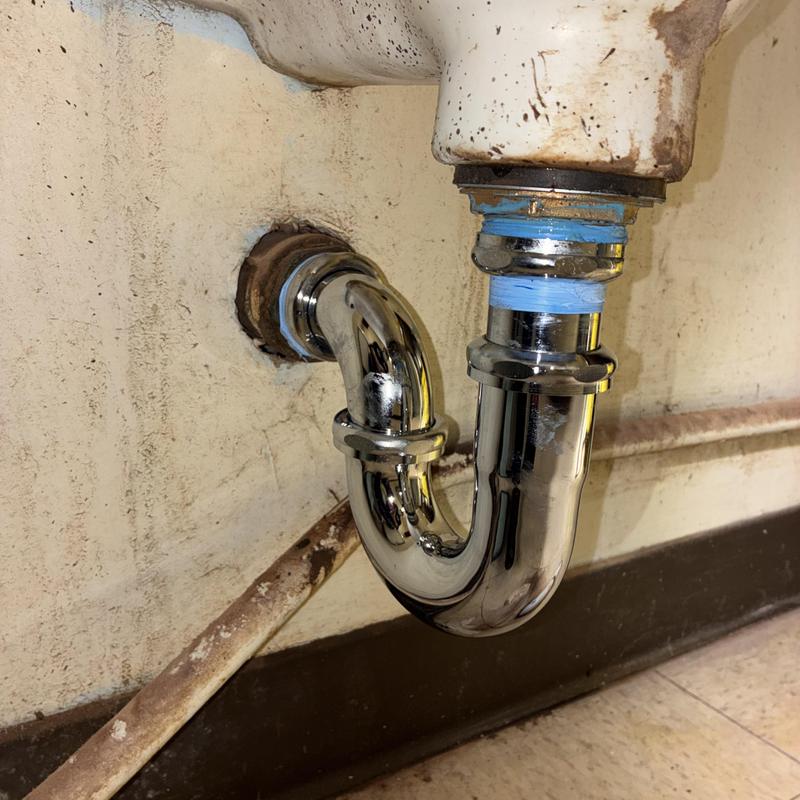 Chrome P-trap with flanged tailpiece in urinal drain