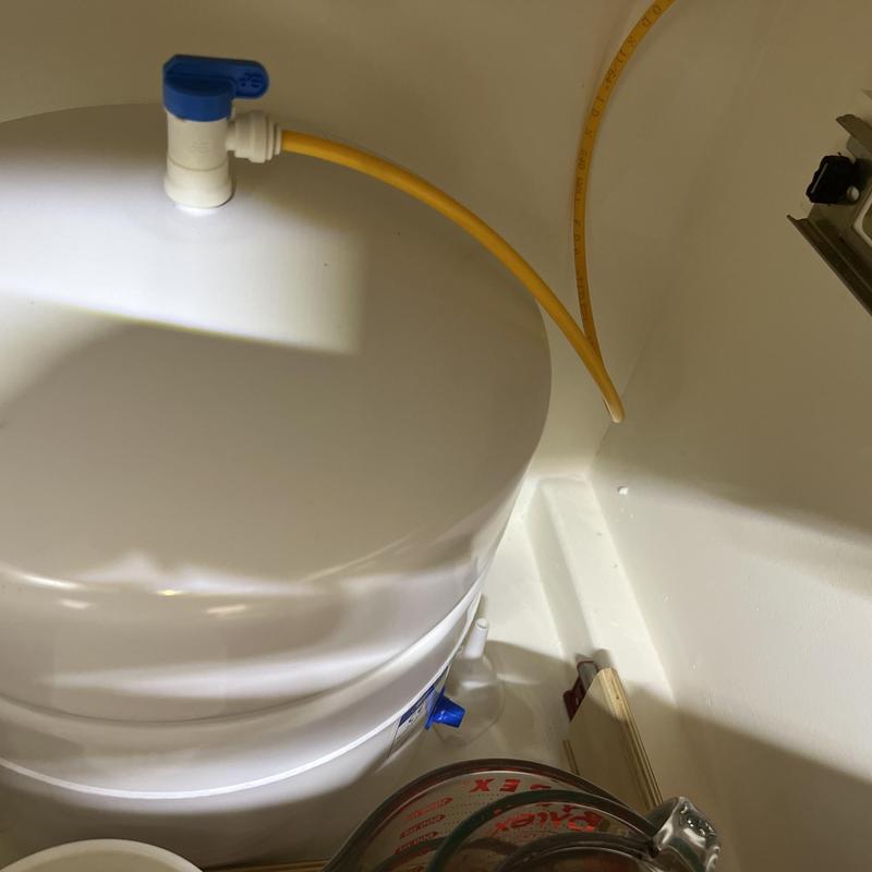 InSinkErator instant hot water dispenser tank and lines under sink