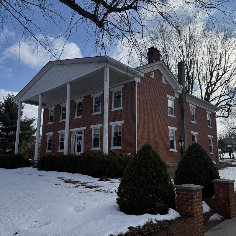 Standing seam aluminum roof with brick siding and windows Standing seam aluminum roof with brick siding and windows