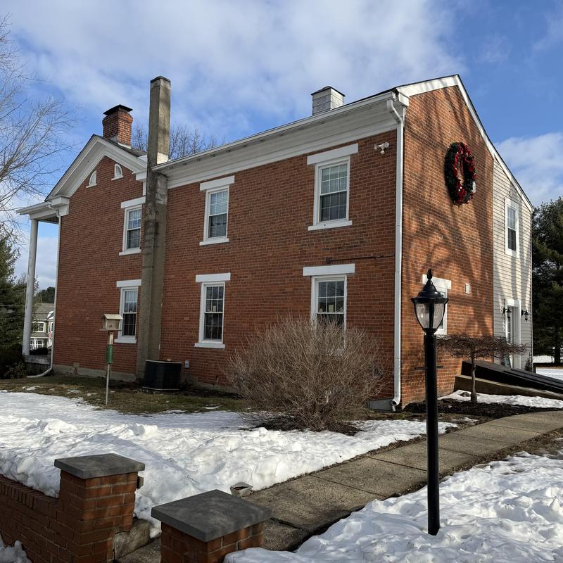 Standing seam aluminum roof with brick siding and windows Standing seam aluminum roof with brick siding and windows