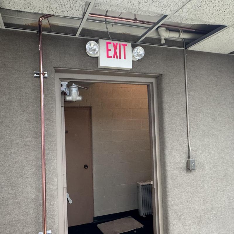 Copper piping reroute above exit door due to leak