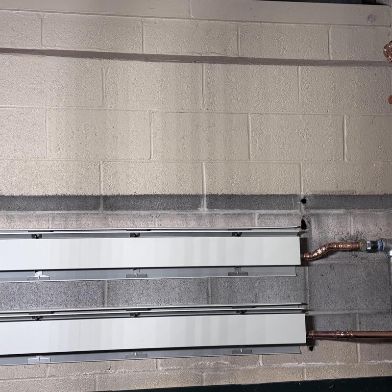 Baseboard heaters with copper line reroute installation