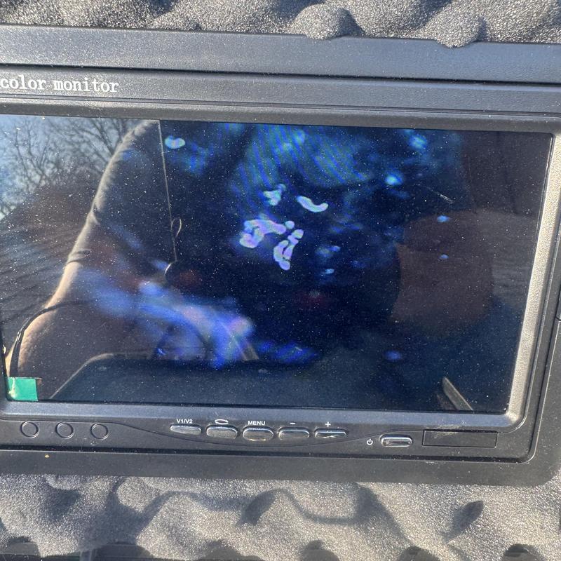 Color monitor screen with fingerprint smudges and buttons