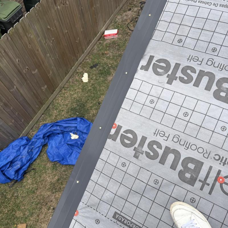 Roof underlayment installation with metal drip edge fastening