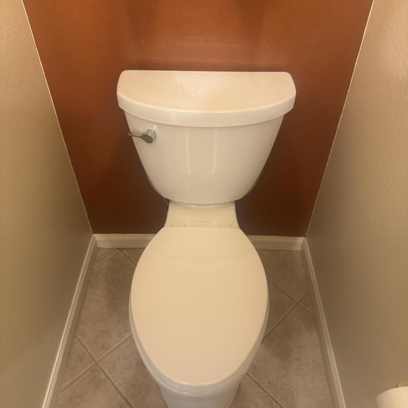 Kohler toilet installed in small bathroom corner