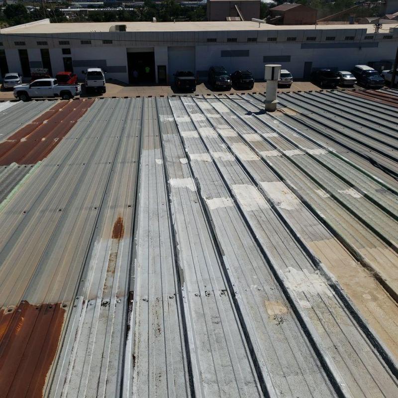 Metal pro-panel roof with rust and patch repairs Metal pro-panel roof with rust and patch repairs