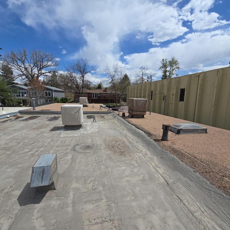 Modified bitumen roof with blistering and gravel roof aging Modified bitumen roof with blistering and gravel roof aging