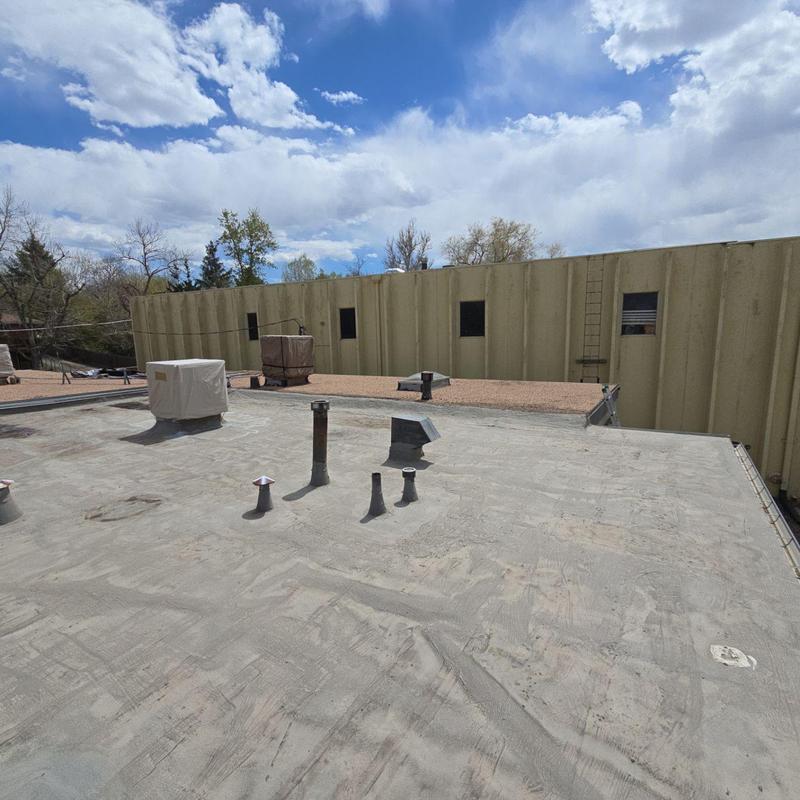 Modified bitumen roof with blistering and wear signs Modified bitumen roof with blistering and wear signs