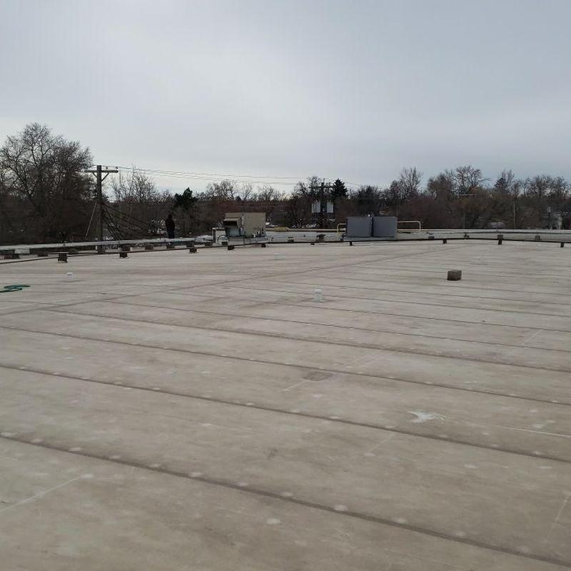 PVC flat roof with visible cracking and seams PVC flat roof with visible cracking and seams