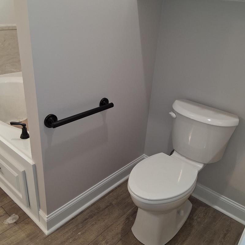 Bathroom grab bar installation beside toilet and tub Bathroom grab bar installation beside toilet and tub