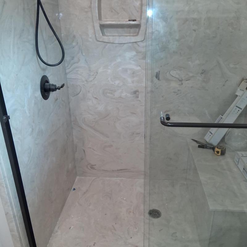 Shower grab bar installation with marble surround Shower grab bar installation with marble surround