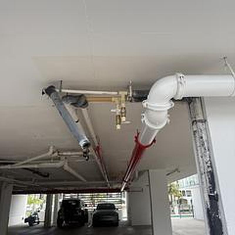 Garage drain valve and pipe installation with flushing system