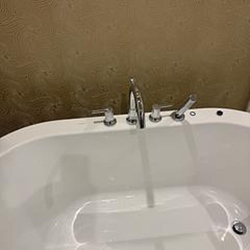 Bathtub faucet with running water in Deerfield Beach