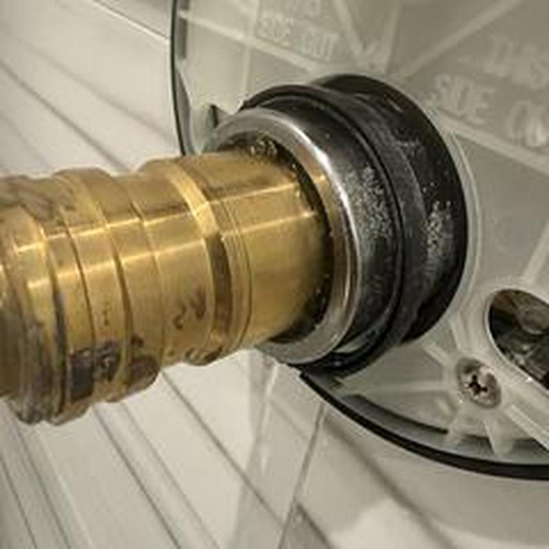 Shower valve cartridge with brass fitting and seal