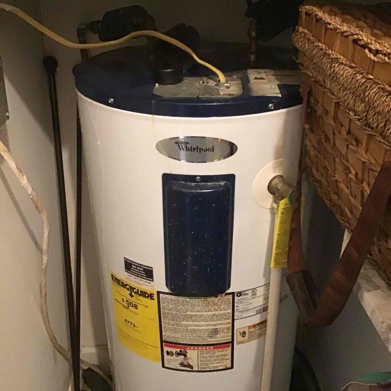 Water heater with Whirlpool brand and energy guide label