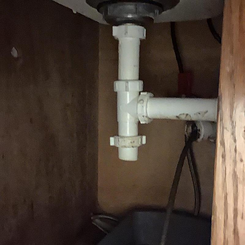 Kitchen sink PVC drain pipes under cabinet in Chattanooga