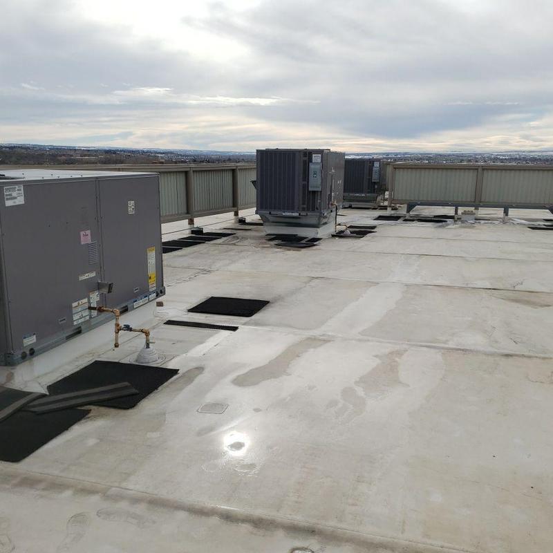 PVC roofing with rooftop HVAC units and flashing pads PVC roofing with rooftop HVAC units and flashing pads