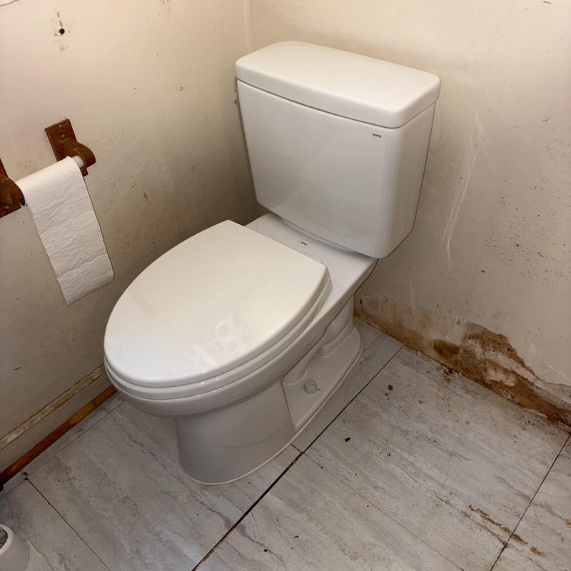 Toto Drake elongated toilet installation in residential bathroom