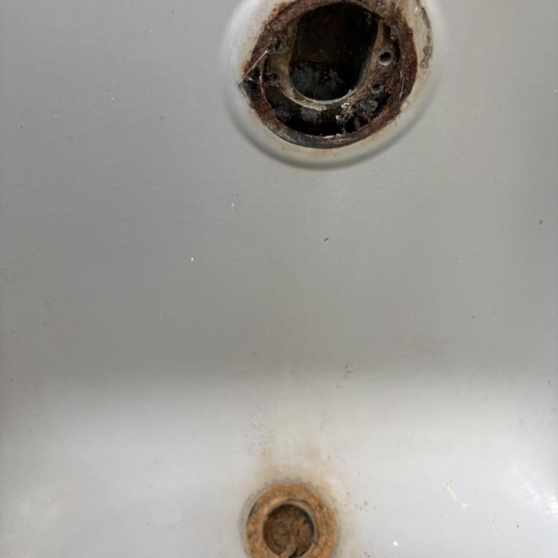 Tub waste and overflow drain with rust buildup
