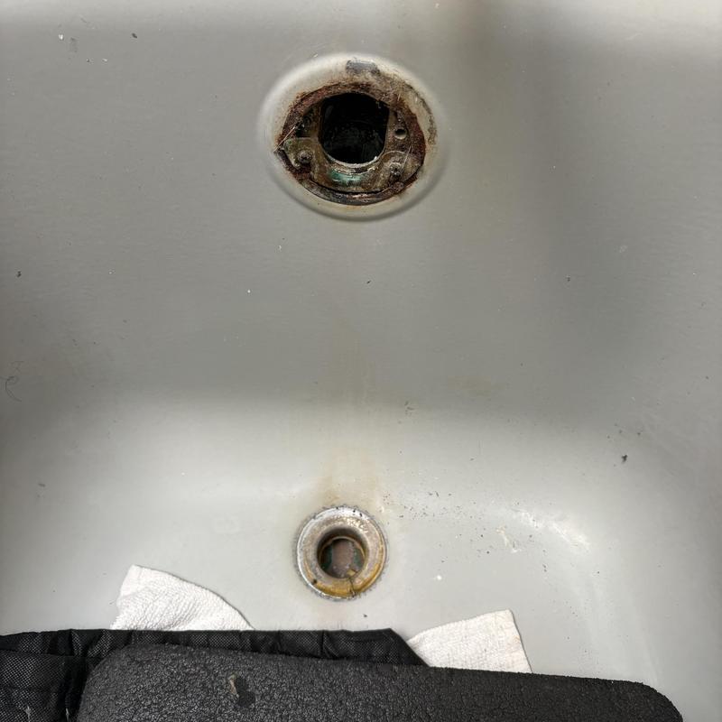 Bathtub waste and overflow opening with corrosion