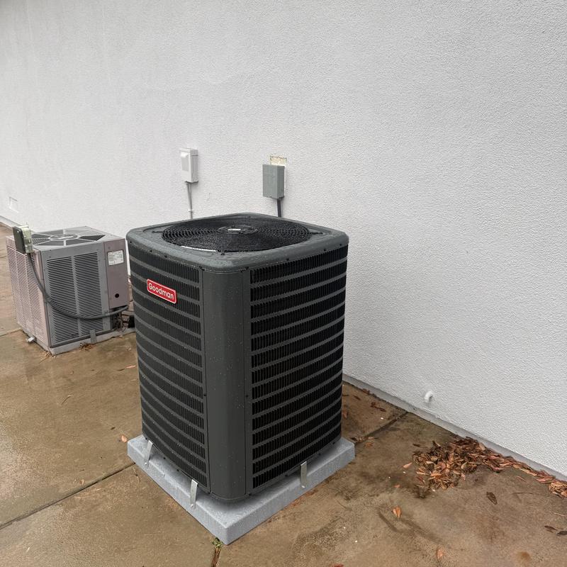 Goodman 3 ton air conditioner on concrete pad outdoors