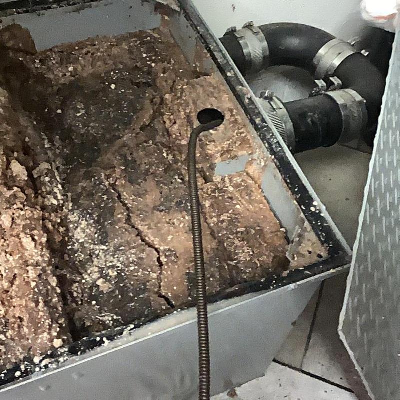 Main sewer line cleaning with plumbing snake tool