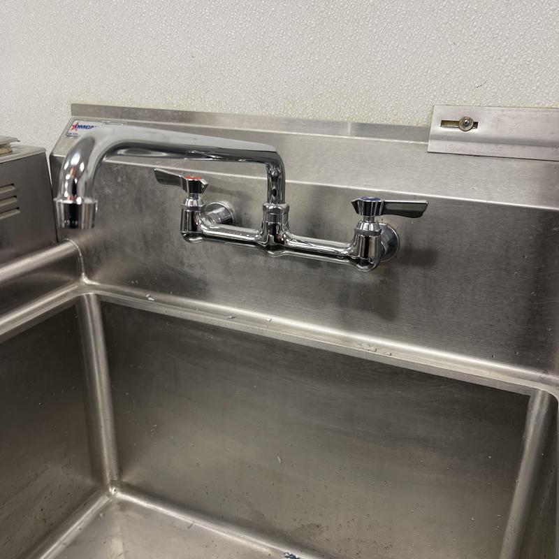 8-inch wall-mounted commercial faucet on sink
