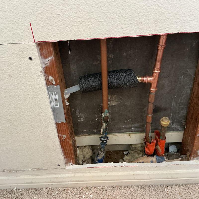 Copper hot-water line with foam insulation in wall cavity