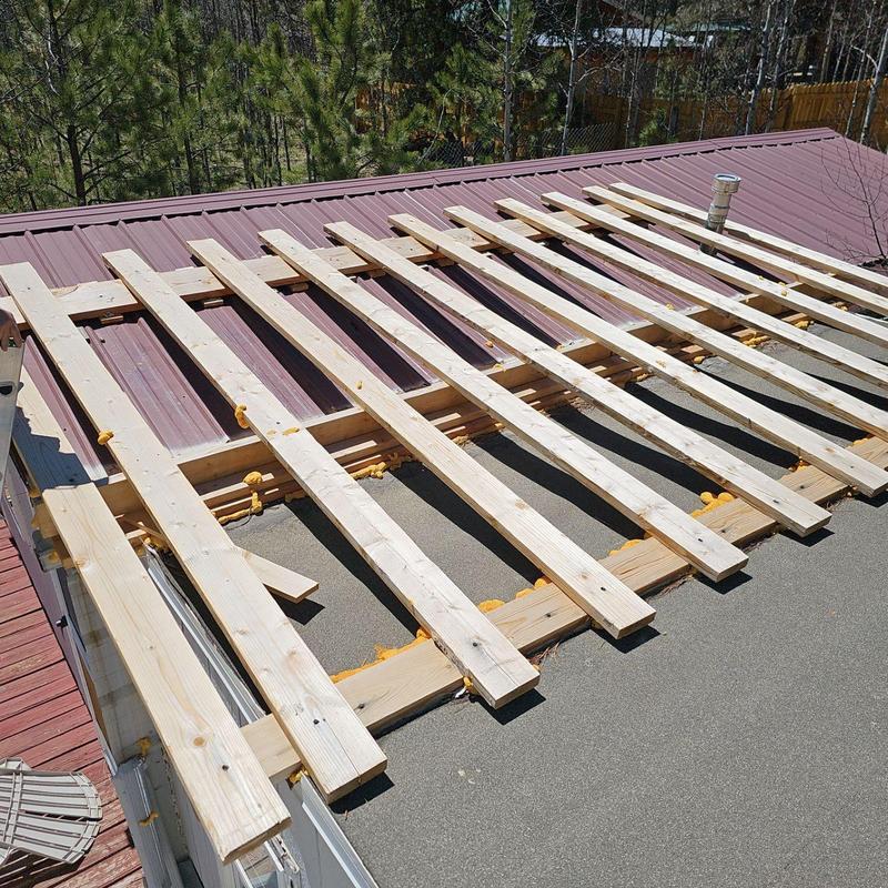 Metal roof framing repair with wooden battens installation Metal roof framing repair with wooden battens installation
