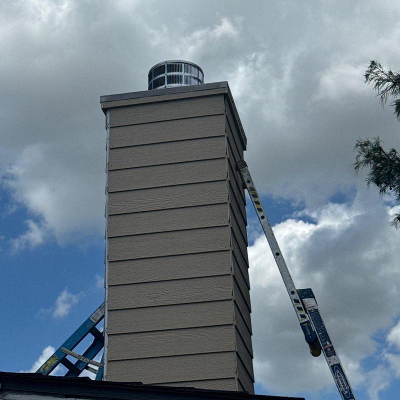 Chimney chase with new LP SmartSide siding and trim Chimney chase with new LP SmartSide siding and trim