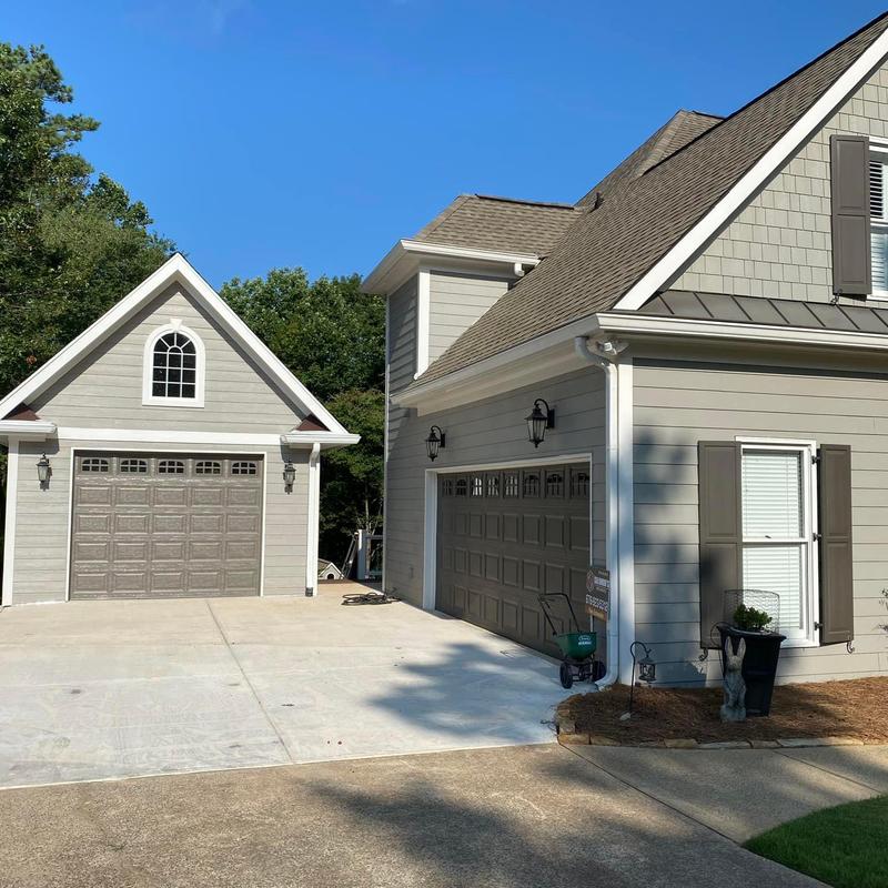 Asphalt shingle roof on garage and house Asphalt shingle roof on garage and house