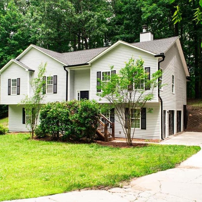 Asphalt shingle roof on suburban two-story home