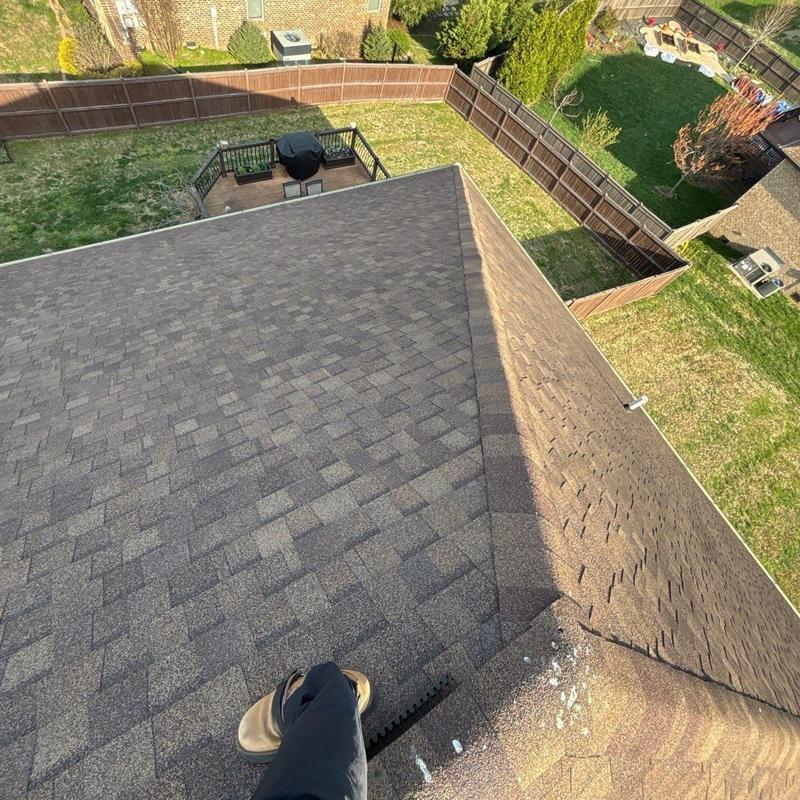 Asphalt shingle roof with visible hail damage