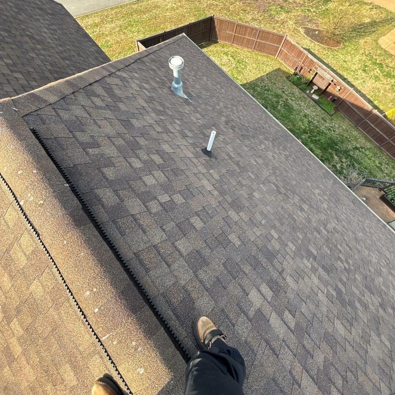 Asphalt shingle roof inspection with vent pipes visible