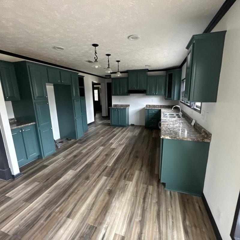 Kitchen cabinets and flooring with new trim and countertops Kitchen cabinets and flooring with new trim and countertops