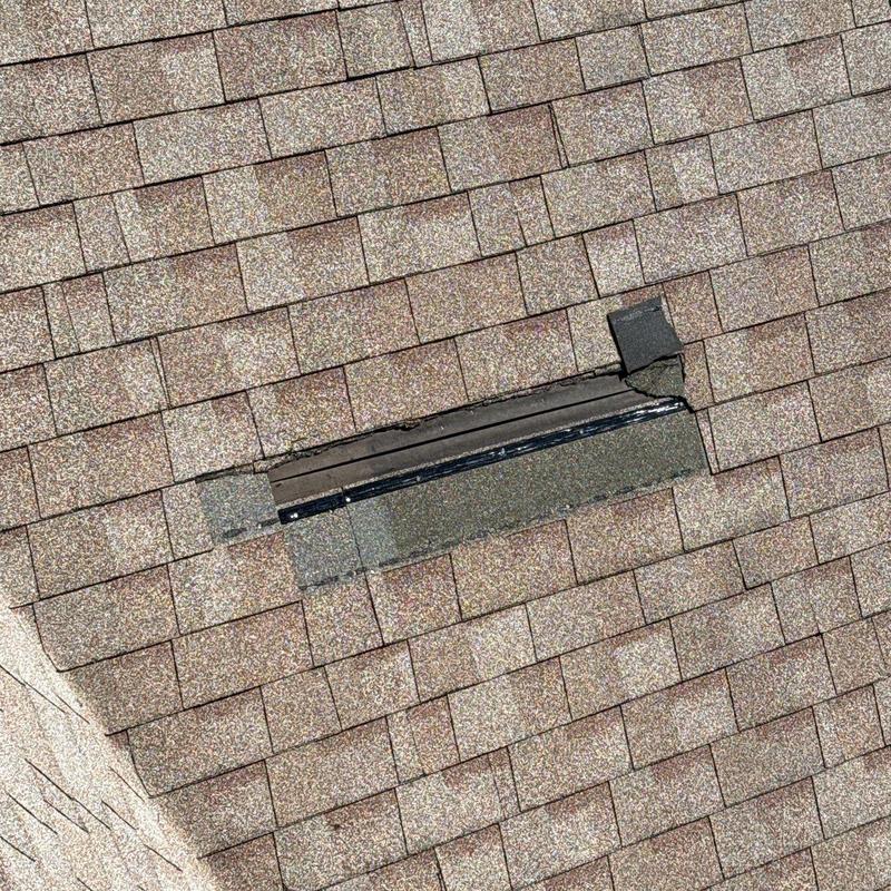 Asphalt shingles with damaged roof vent flashing