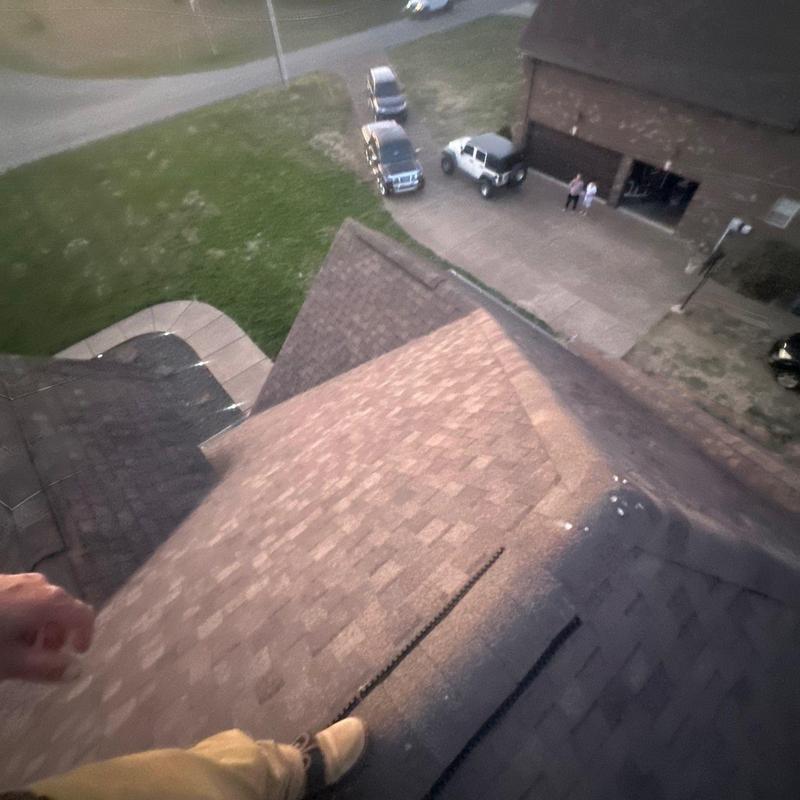 Asphalt shingle roof with hail damage inspection