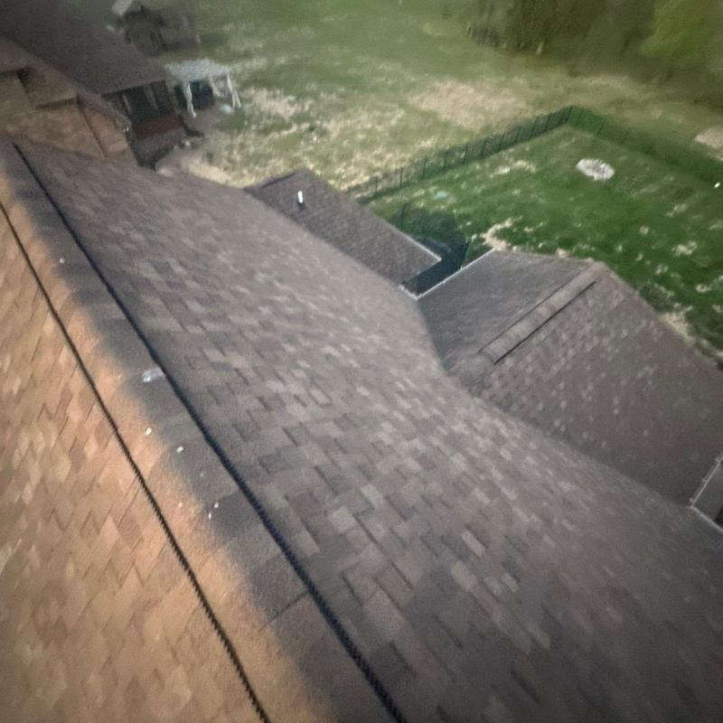 Asphalt shingle roof with hail damage inspection