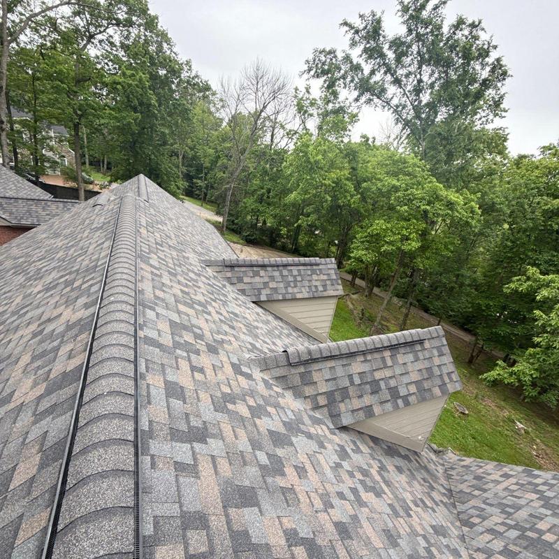 Asphalt shingle roof with ridge and flashing inspection