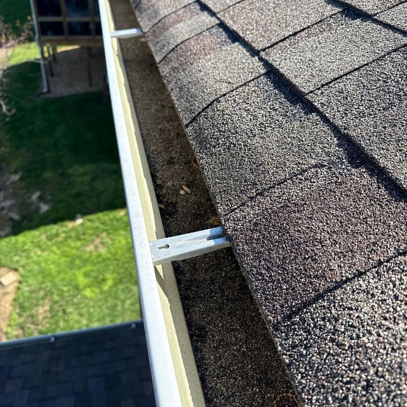 Asphalt shingle roof and gutter hangers inspection