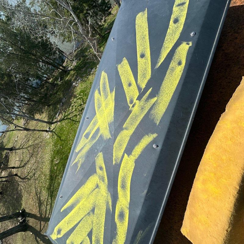 Roof flashing marked for damage inspection