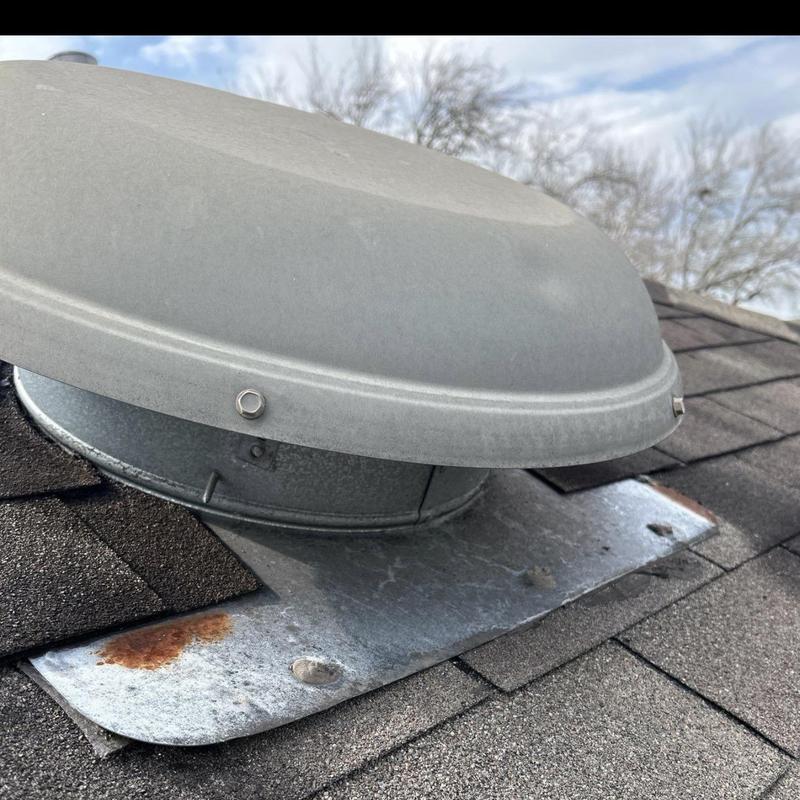 Roof vent flashing with rust and shingle wear