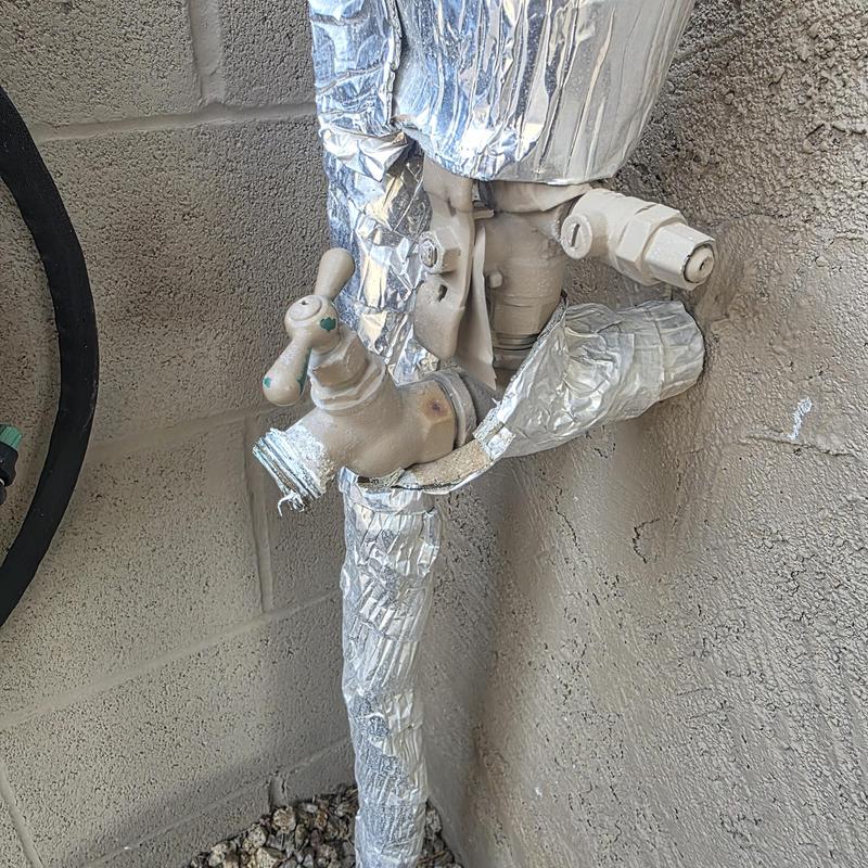 Backyard hose bib with metal insulation wrap