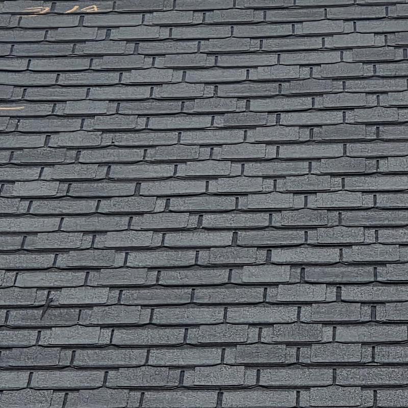 Asphalt shingle roof with wind and hail damage