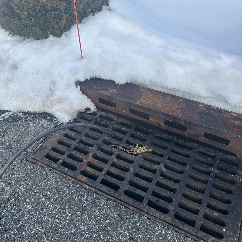 Storm drain jetting with hose near snow in Fairfield NJ Storm drain jetting with hose near snow in Fairfield NJ