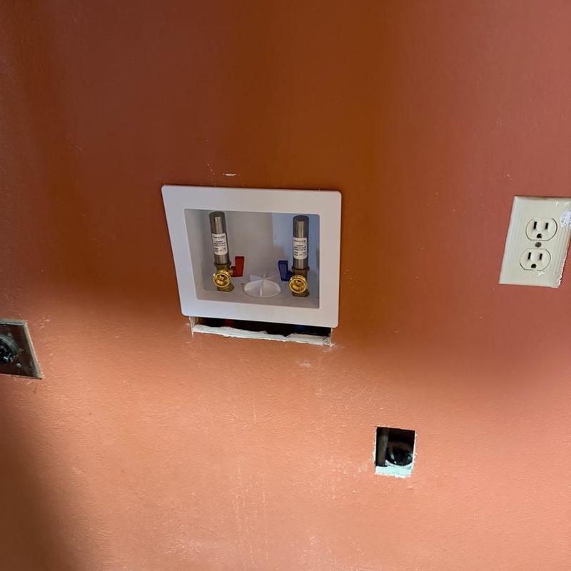 Washer box with new plumbing connections in wall