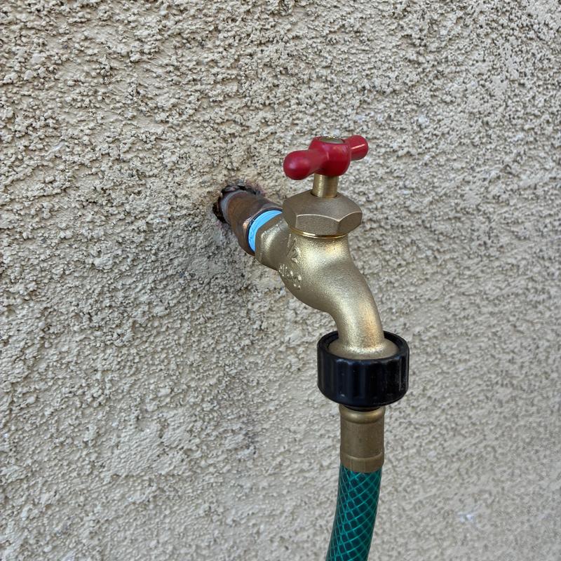 Outdoor hose bib and attached garden hose connection