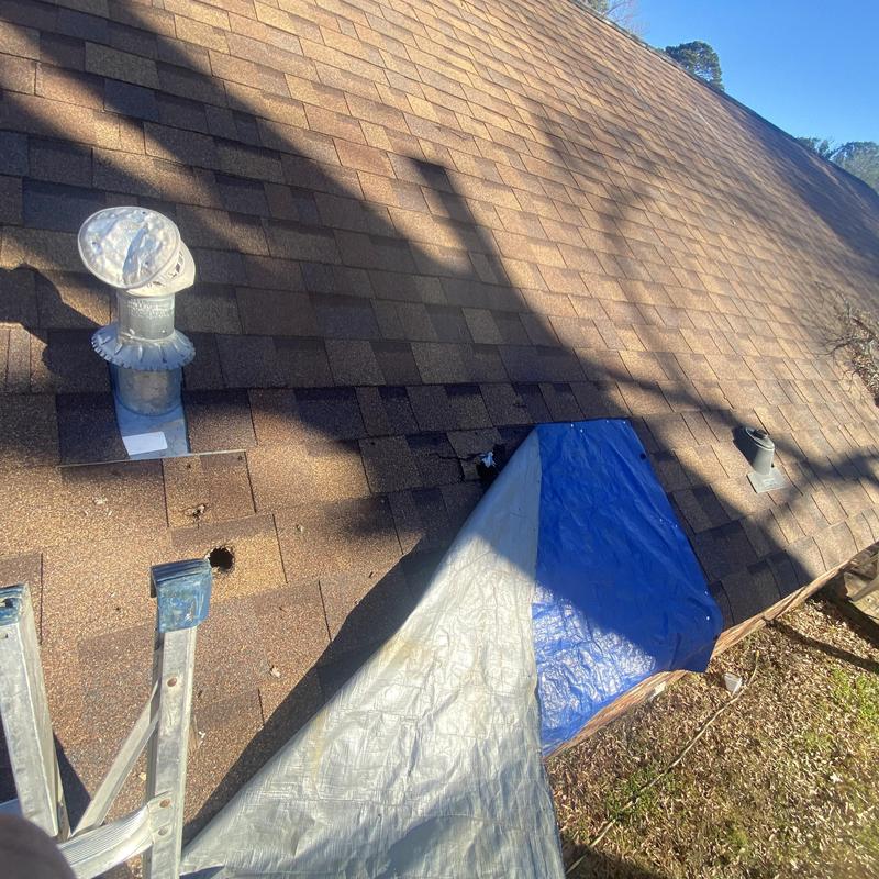 Asphalt shingle roof with tarp after tree damage Asphalt shingle roof with tarp after tree damage