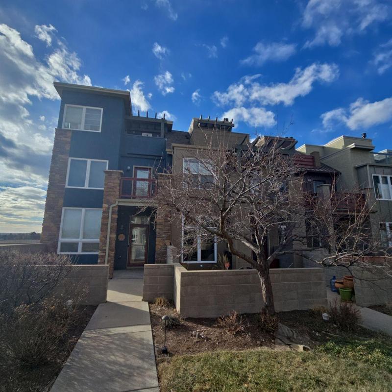 Shingle and flat roofs on residential building exterior Shingle and flat roofs on residential building exterior